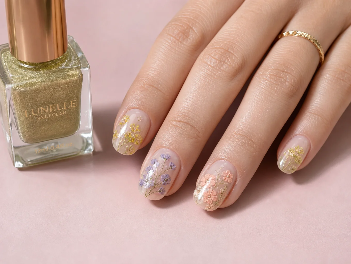 Artistic hand-painted botanical nail art on neutral matte overlay