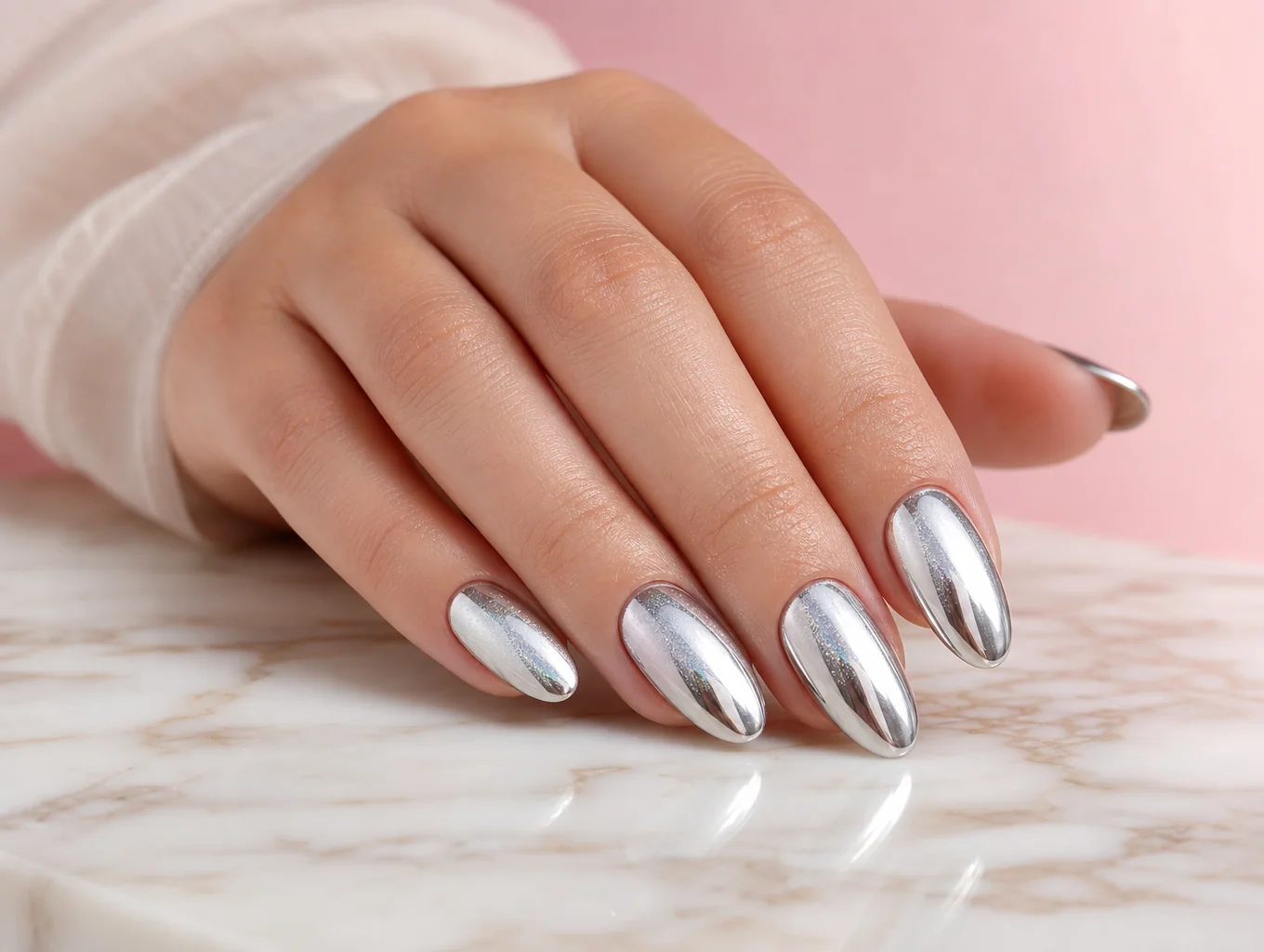 Champagne velvet chrome nail extensions with luminous reflective shine